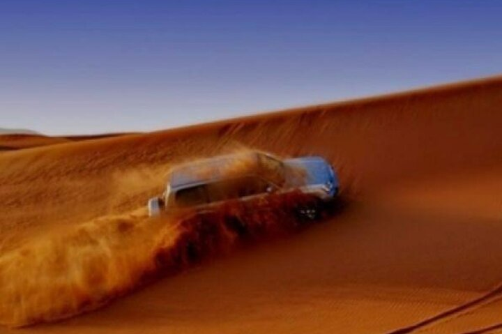 Experience the thrill of desert adventures as you cruise through stunning dunes in a 4x4. Witness the breathtaking landscape of Dubai's desert and create unforgettable memories.